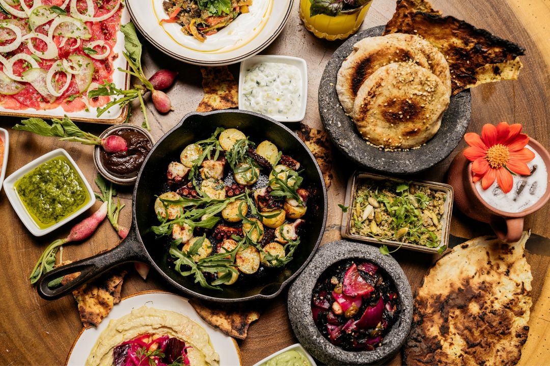 Zapote Bar_Aerial Shot of a variety of colorful dishes, plates and beverages served to share